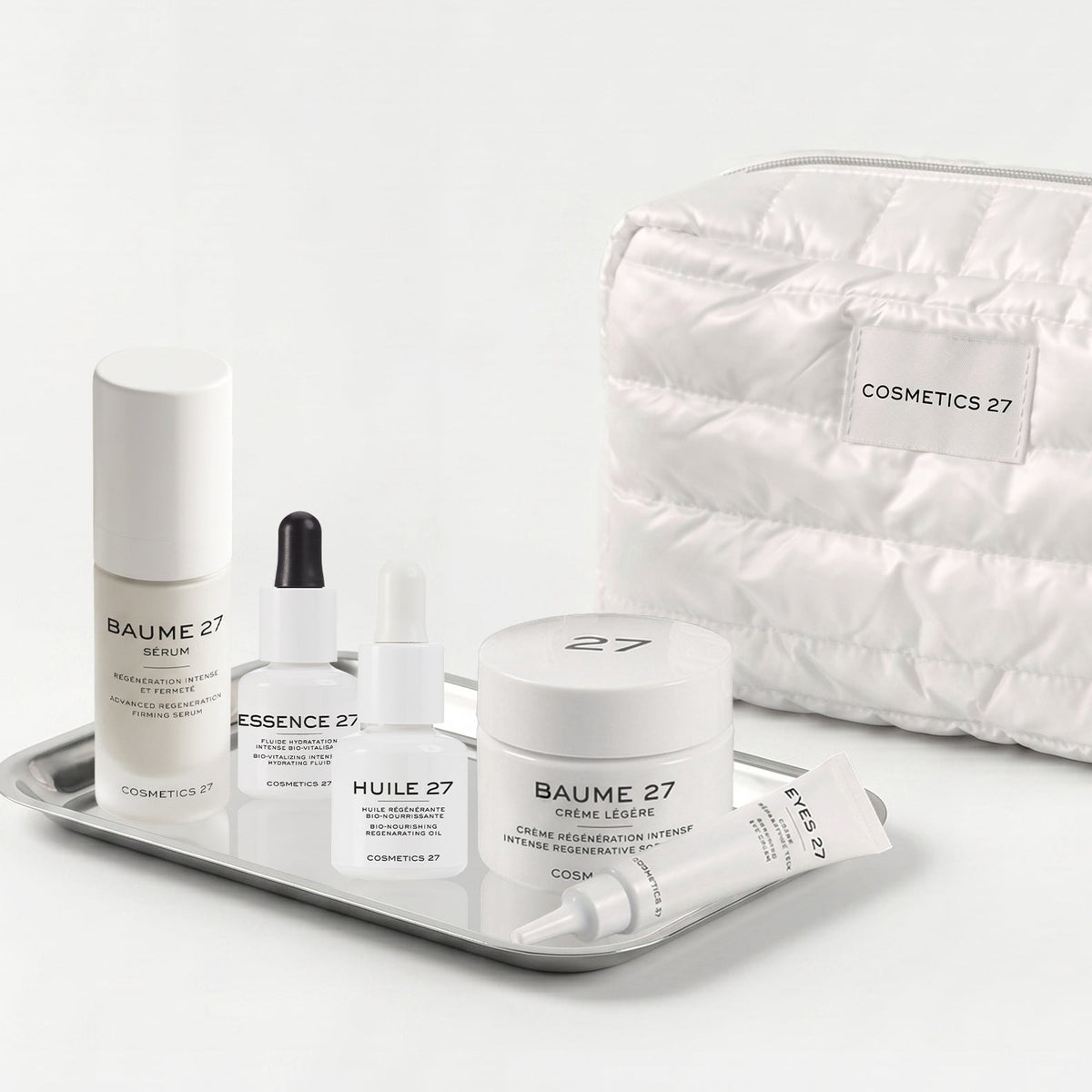 The five program products on a silver tray, white quilted pouch behind