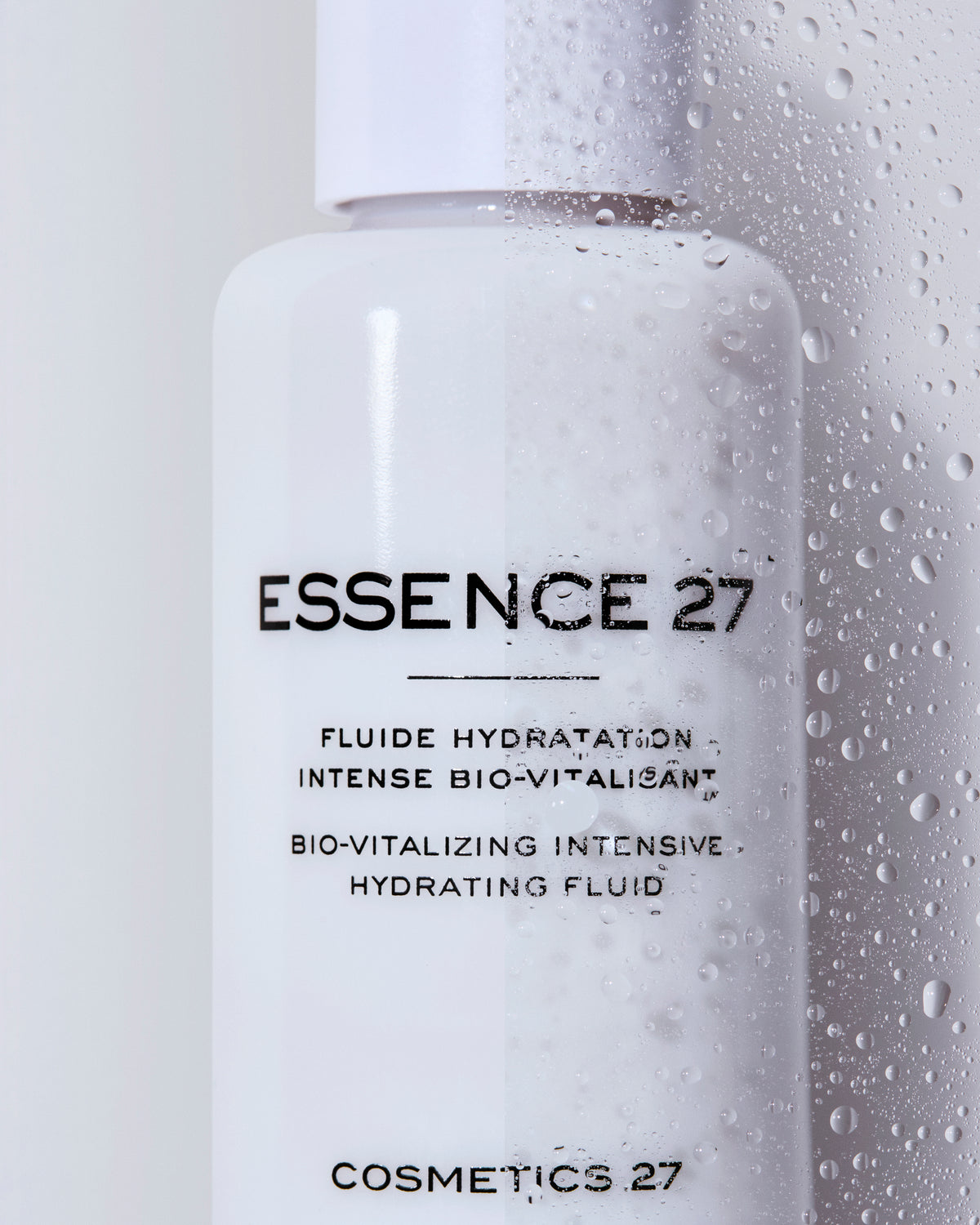 Close-up of the Essence 27 bottle covered in water droplets