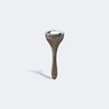 Metal Ridoki roller on a light gray background