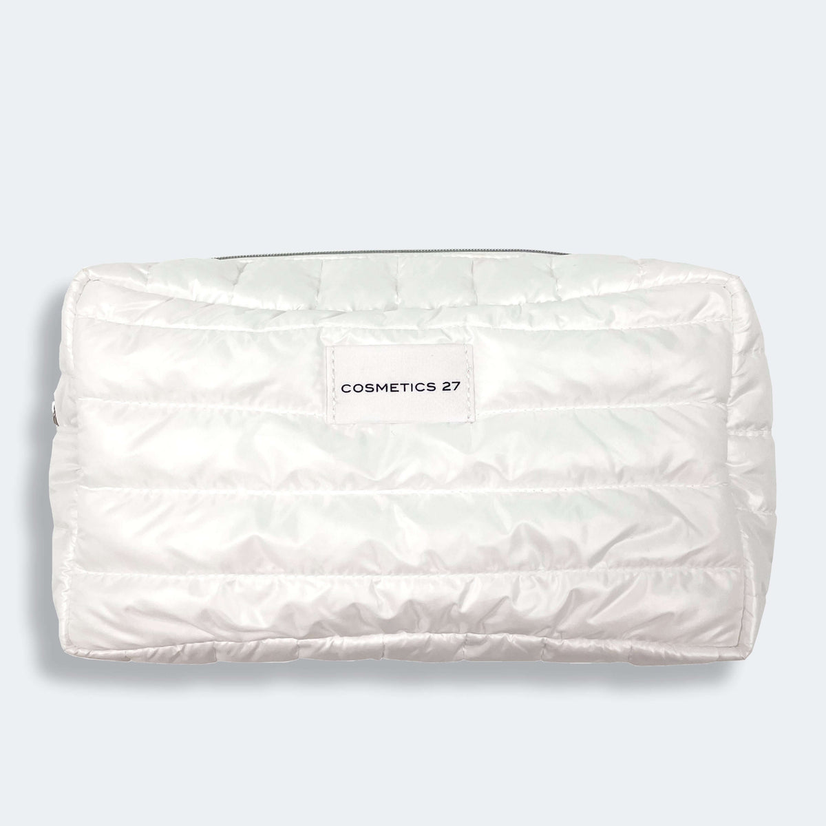 White quilted Vanity Case pouch with a Cosmetics 27 label